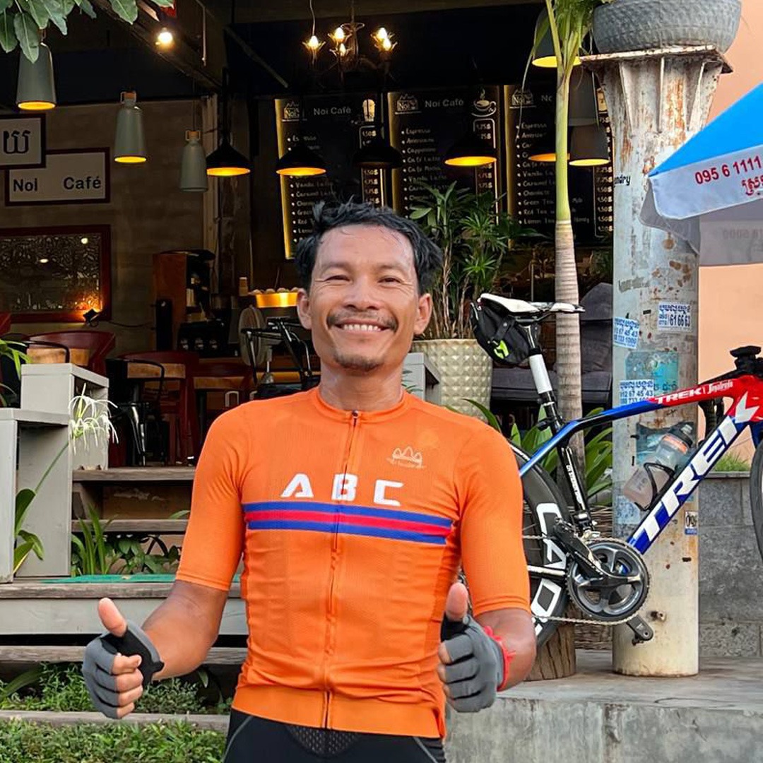 Senior cycling guide in Cambodia